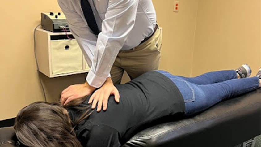 ALT: Doctor providing chiropractic care for back pain relief