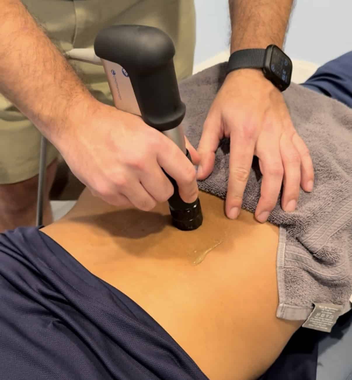 Dr. Czekaj using shockwave on a patient